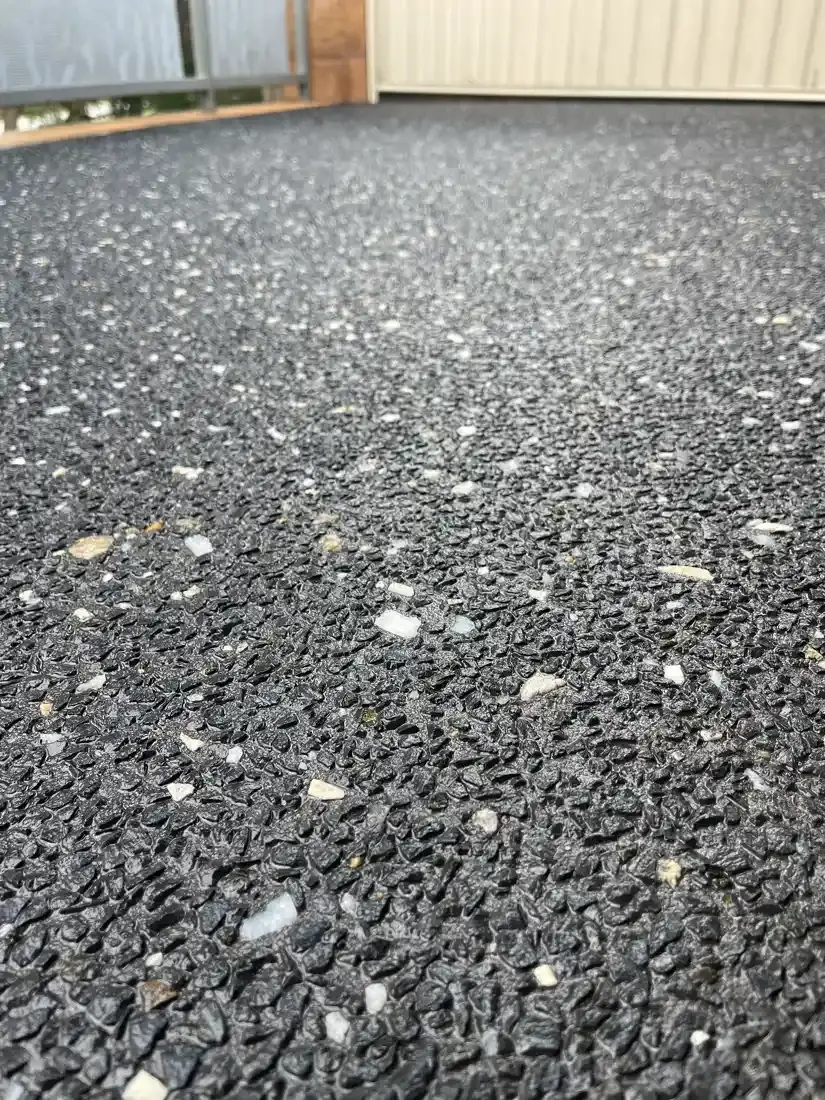 Charcoal aggregate with pale stone showing through