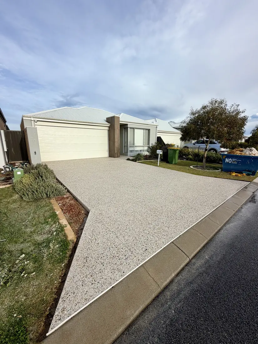 Finished exposed aggregate driveway in full sun at a Perth home