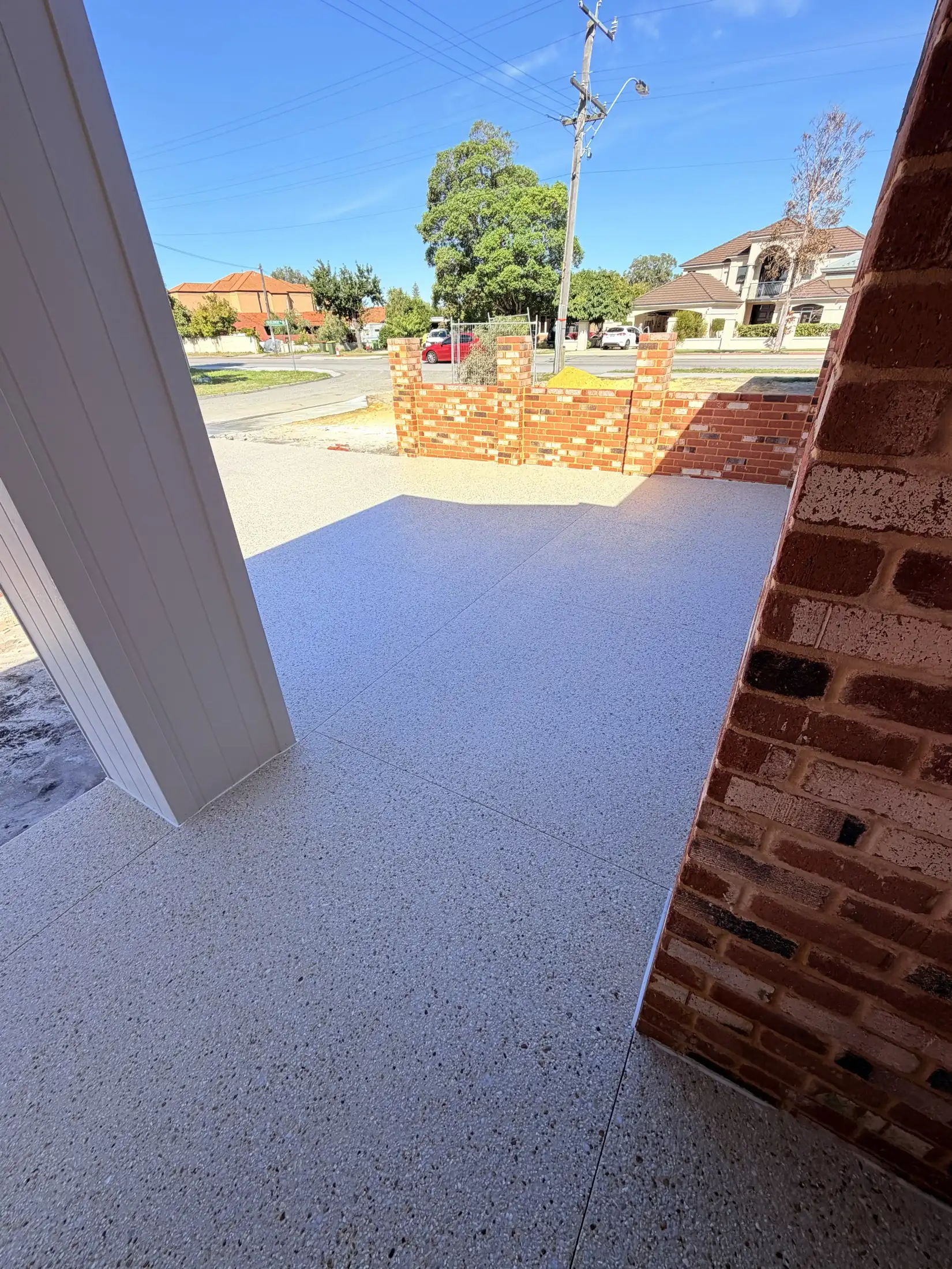 Smooth honed concrete across a sheltered Perth entry