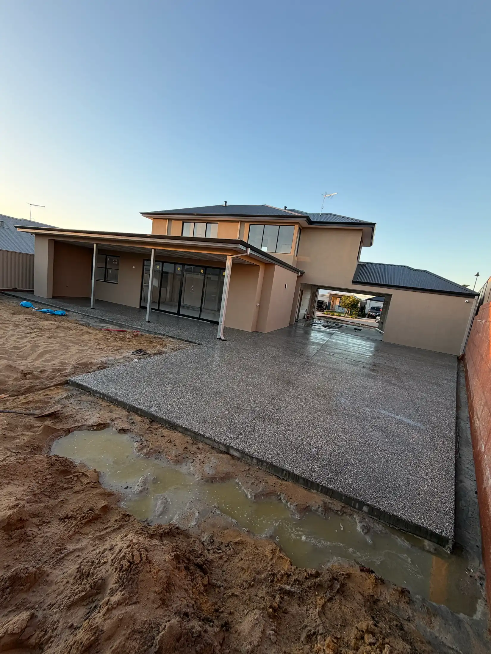Freshly sealed exposed aggregate house surround, new Perth home
