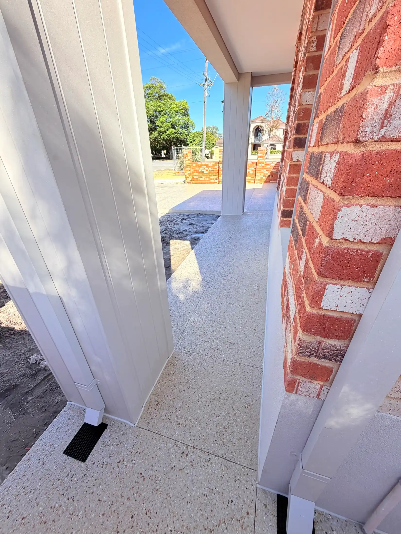 Honed concrete patio under a new alfresco, Perth home