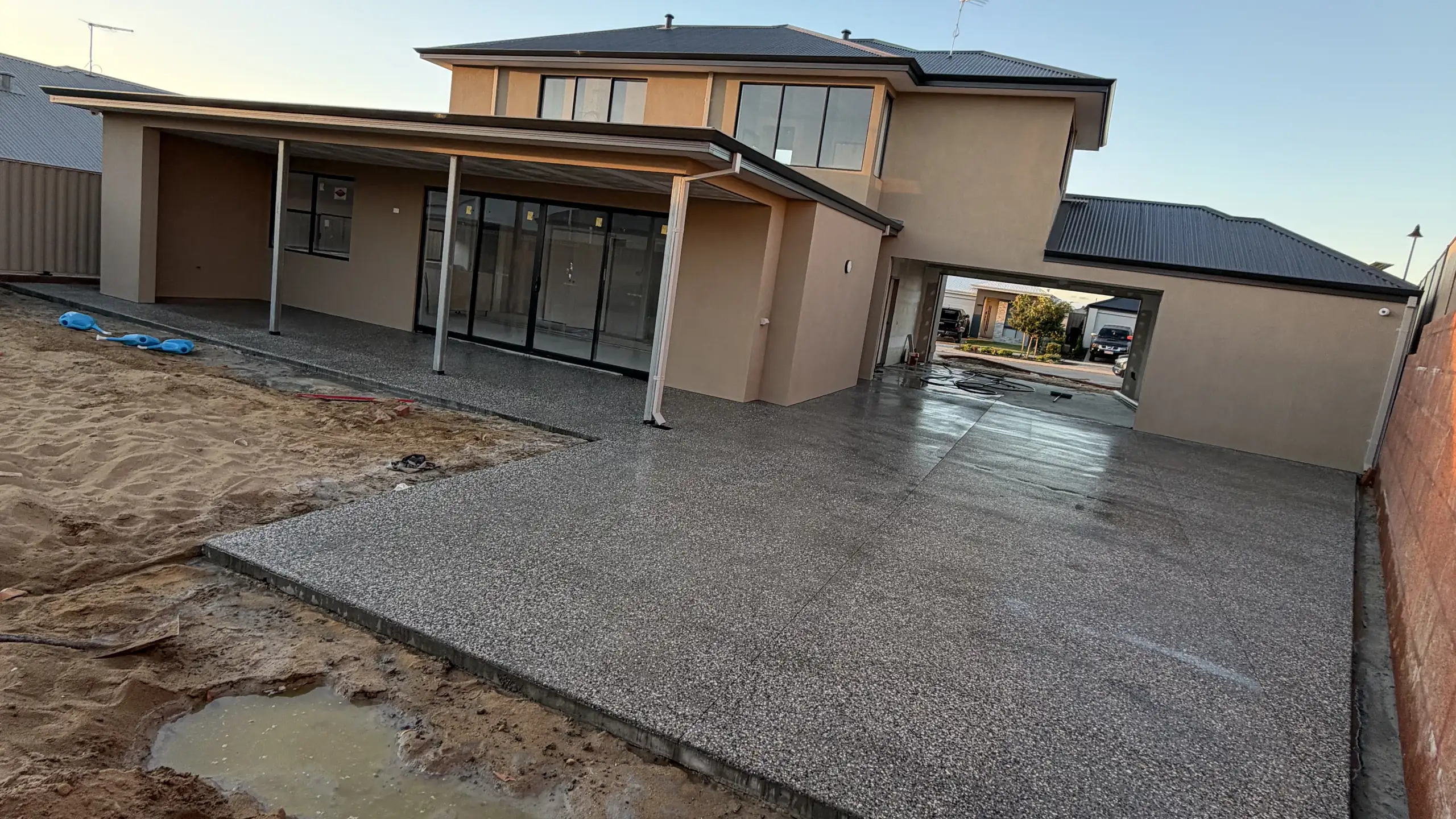 Fresh exposed aggregate house surround poured at a new-build Perth home