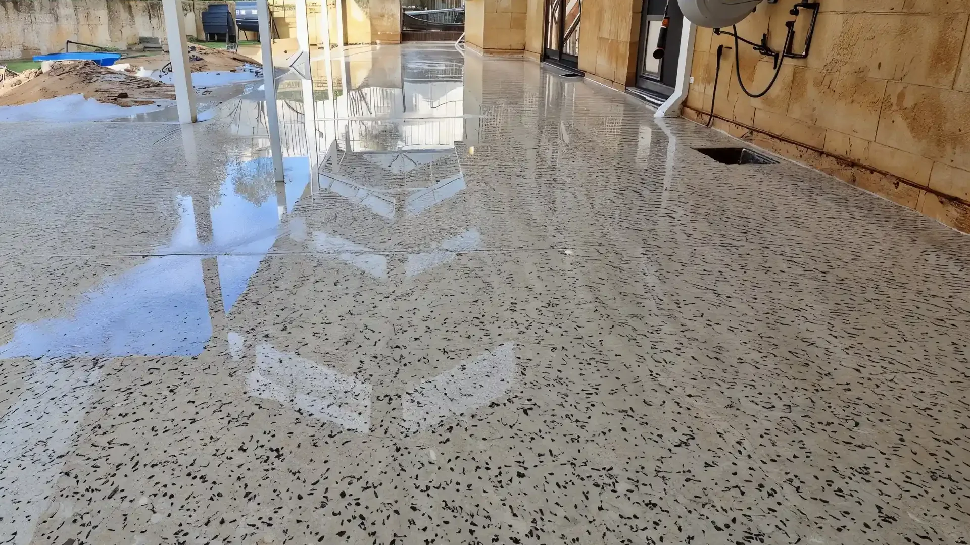 Wet-look honed concrete across a covered Perth alfresco